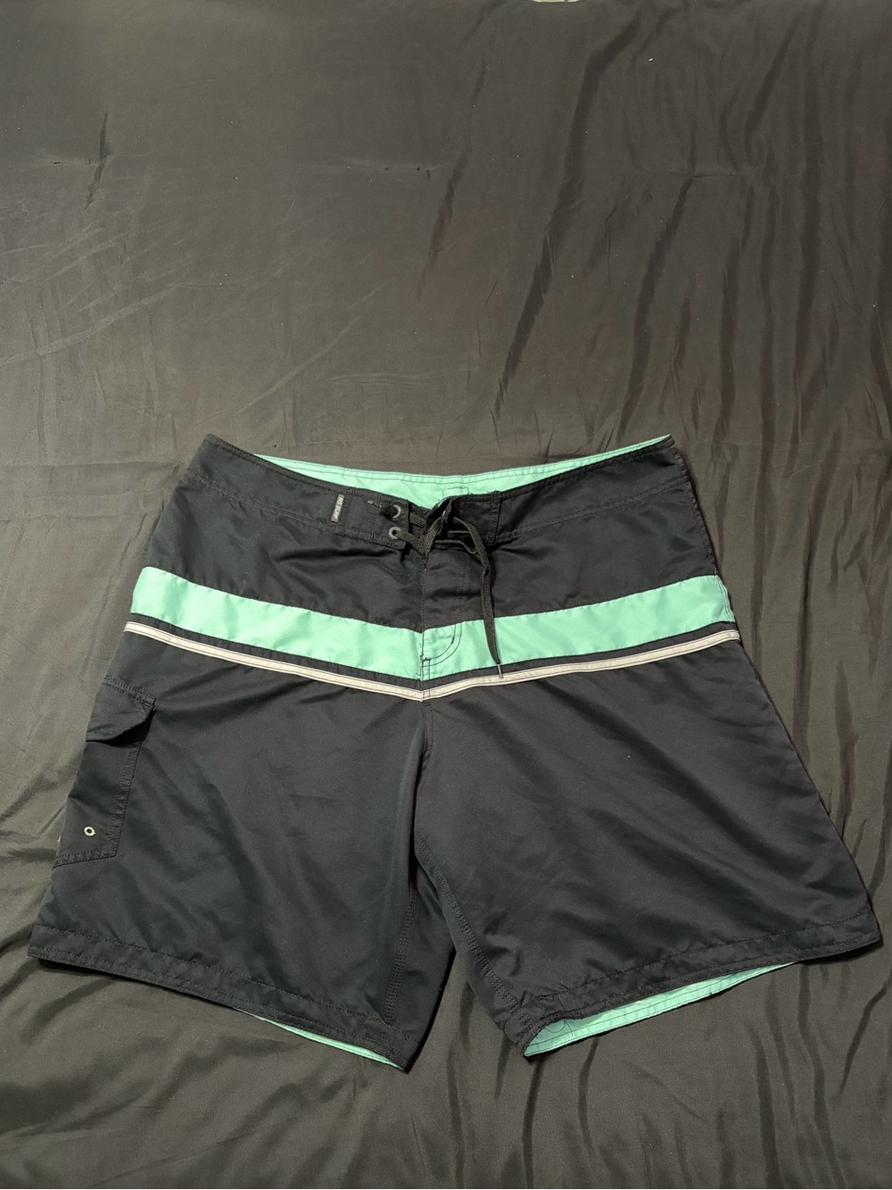 Y2K 2000s Rssurf black swim shorts with teal horizontal stripe. Size 40.